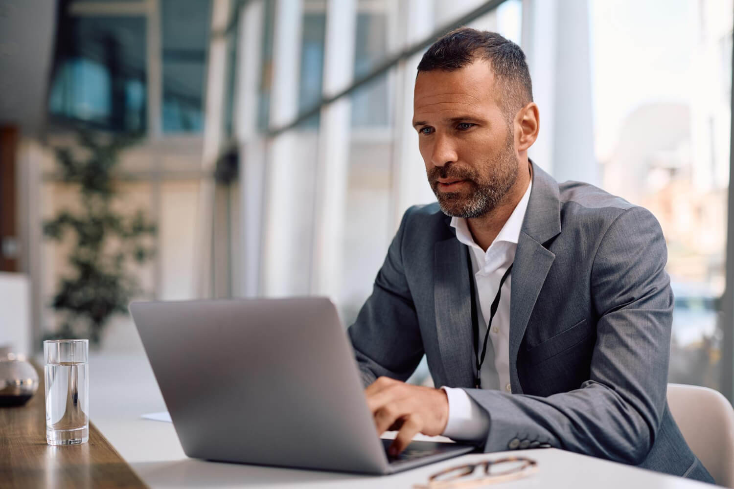 mid adult businessman working on a computer in the office