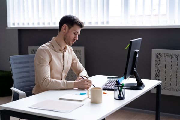 Smartly dressed person working at desk