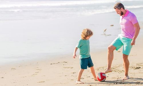 Dad and son on the beach